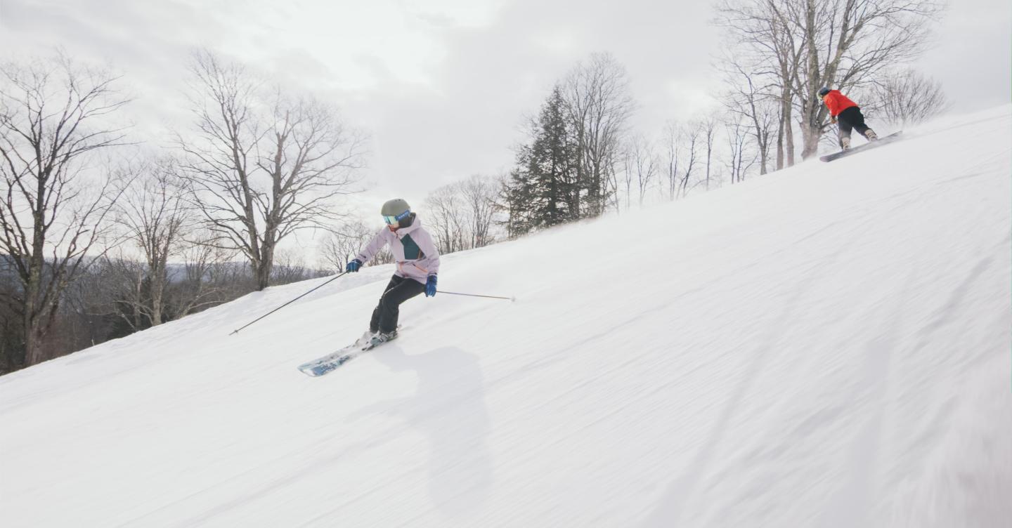 Skier and Snowboarder on the mountain