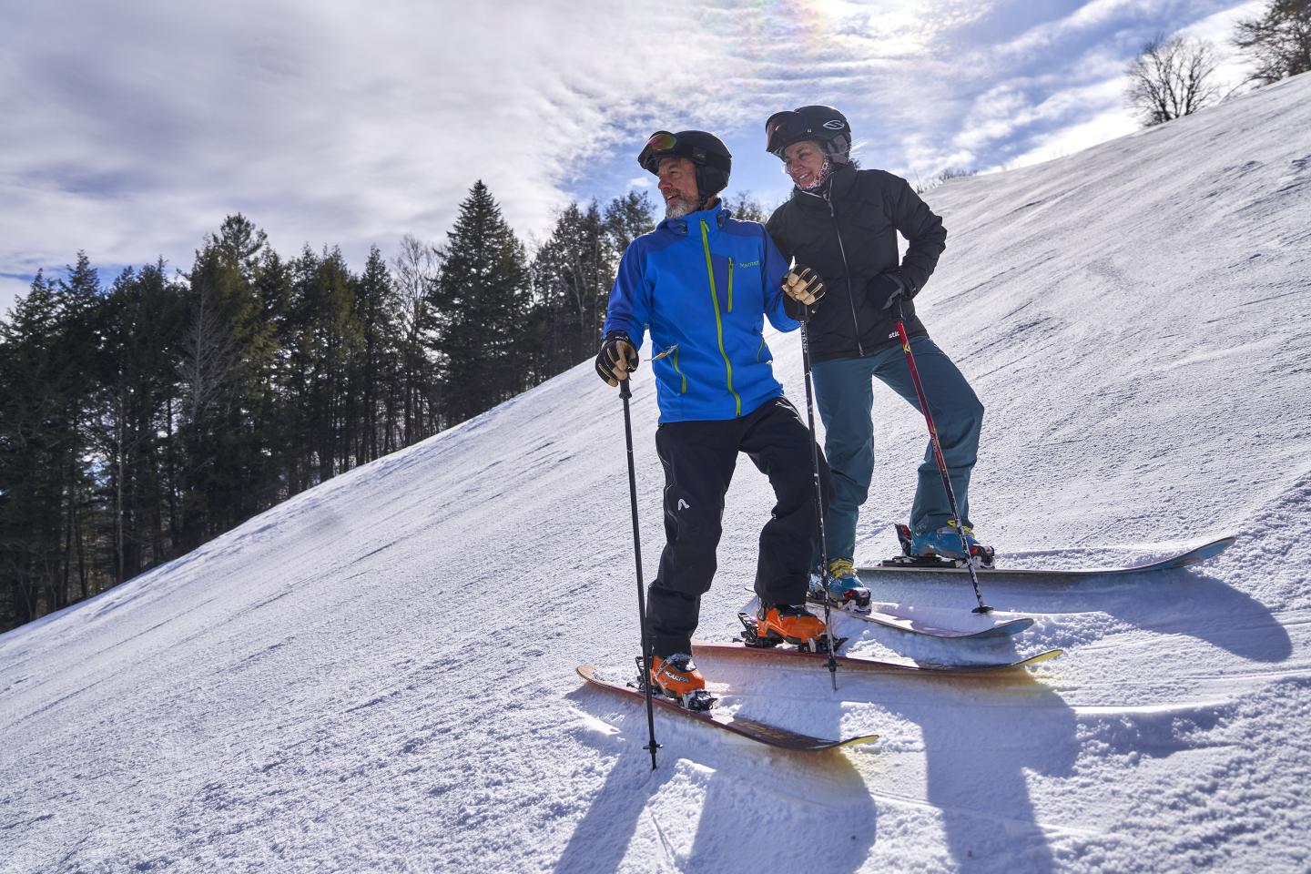 Skiing couple look down The Face trail