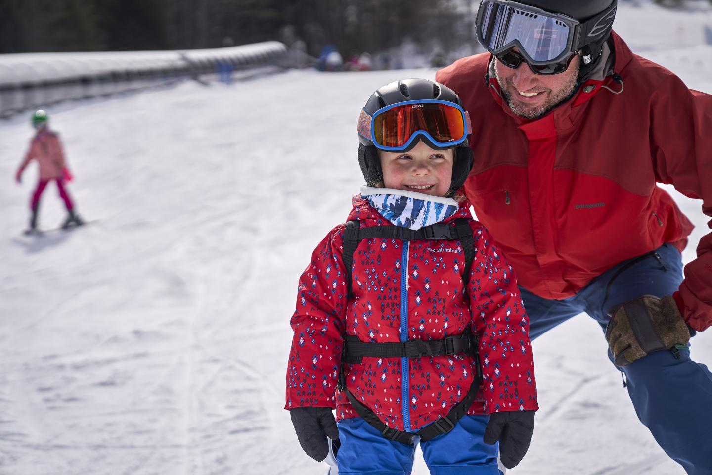 Child Smiling while skiing