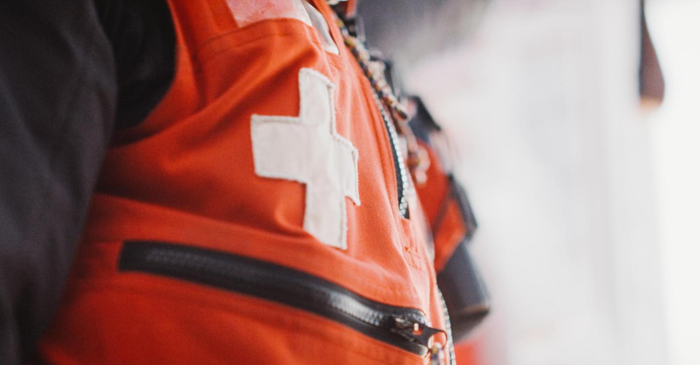 Saskadena Six Ski Patrol red safety vest with white cross patch